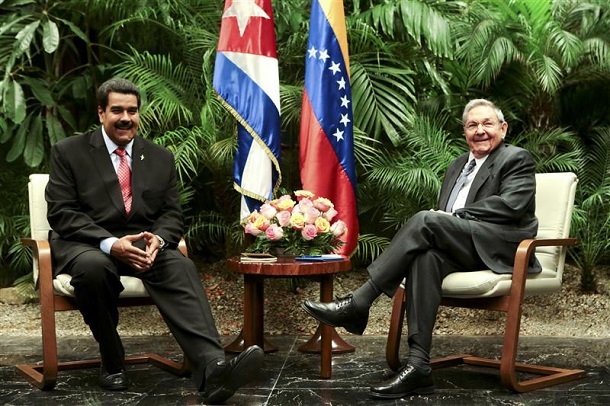 Venezuela's President Maduro speaks with Cuba's President Castro during their meeting in Havana